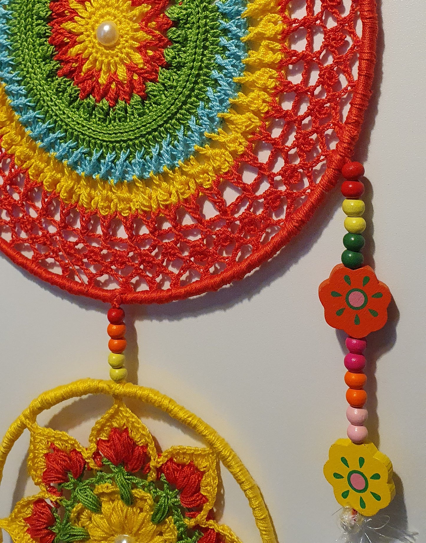 Colorful crocheted dreamcatcher with beads