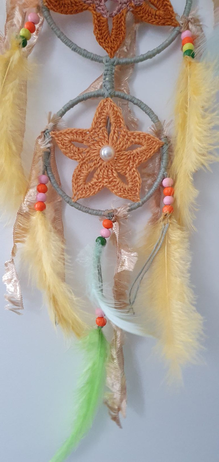 wooden beads and feathers decorated dreamcatcher
