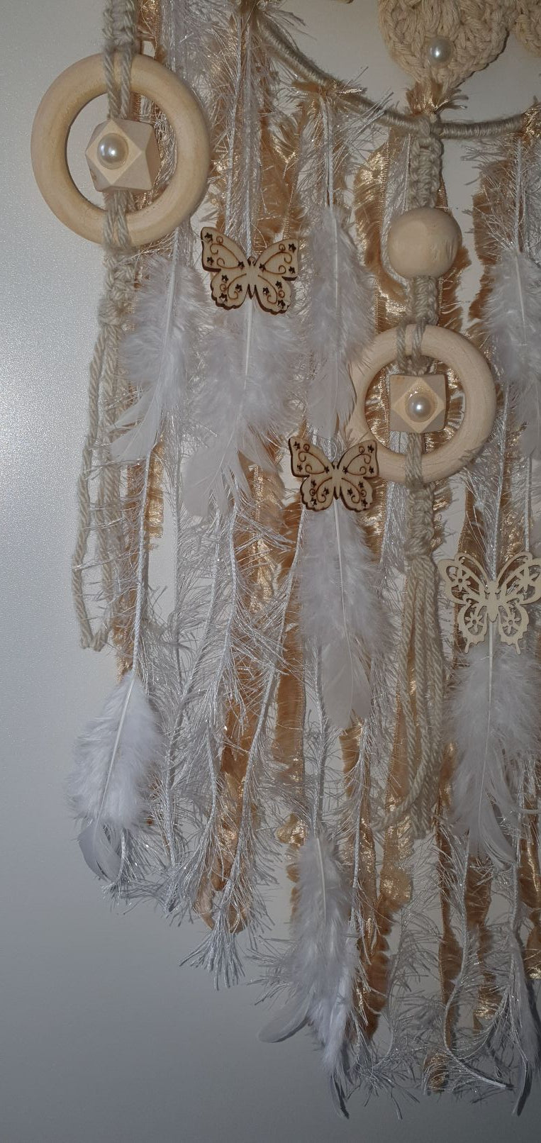 pastel dreamcatcher decorated with wooden ring an bead