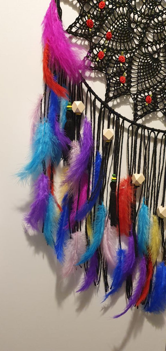 Colorful feathered decorated black dreamcatcher