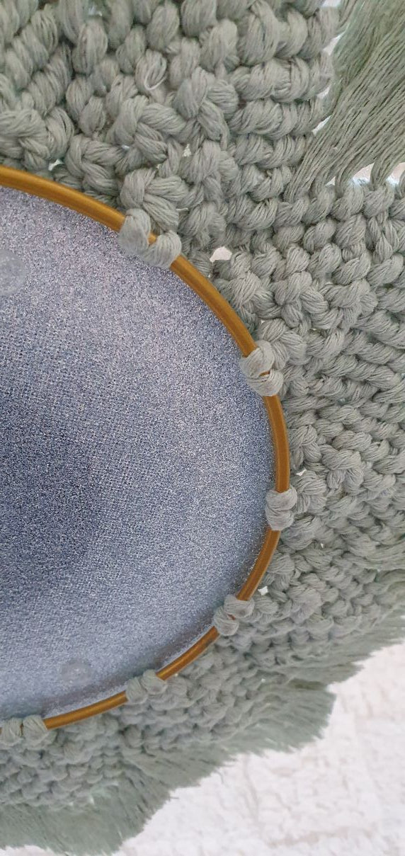 Rund mirror between 2 metal rings