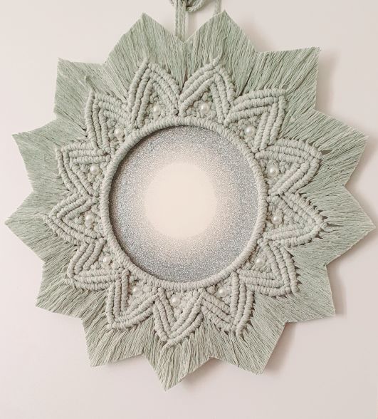 round mirror in the macrame frame