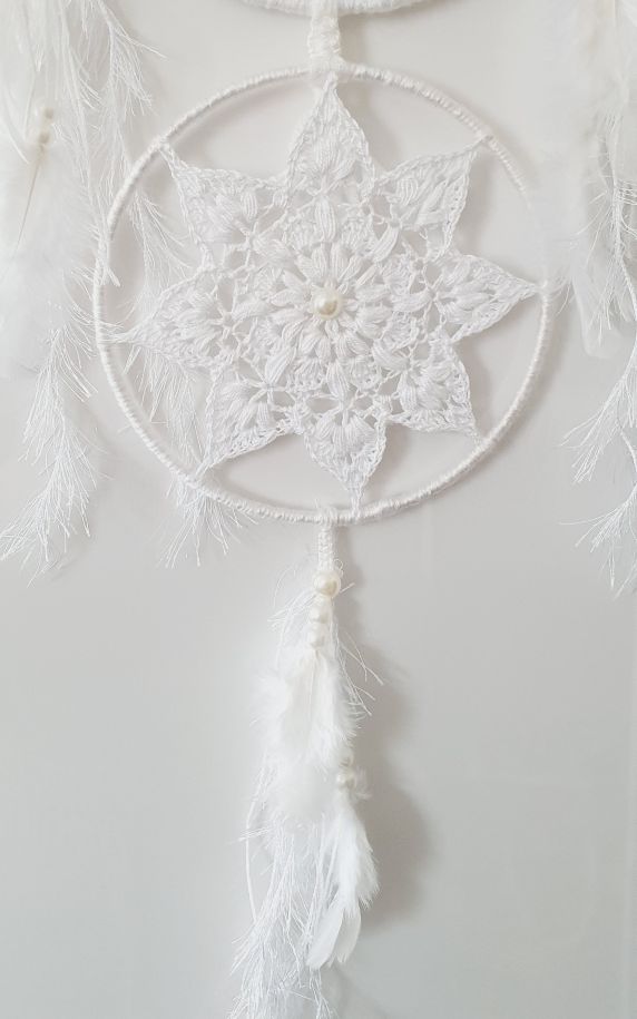 White dreamcatcher with feathers