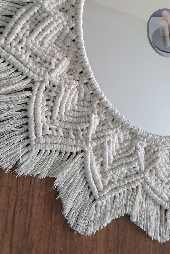 round mirror in a solid metal frame