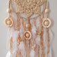 - White and beige feather wall decor
