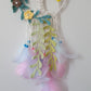 colorful macrame dreamcatcher with crochet flowers