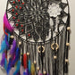 Black lace dreamcatcher with colorful feathers 