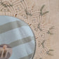 Decorative round mirror with beaded frame 
