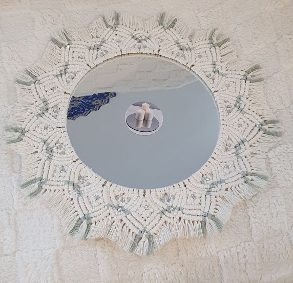 Round mirror with decorative macrame frame