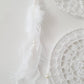 White crochet dream catcher with feathers 