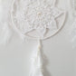 White dreamcatcher with feathers 