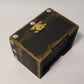 small black wooden box with nail