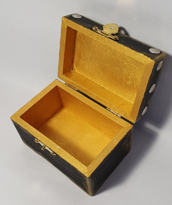 inside gold small black wooden box