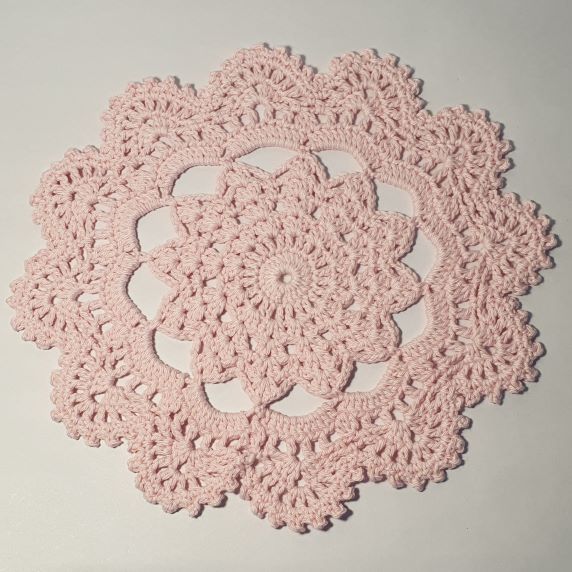 pink round crochet coaster 