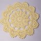 yellow round crochet coaster