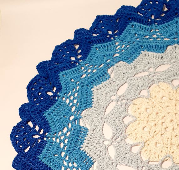 large blue round crochet coaster