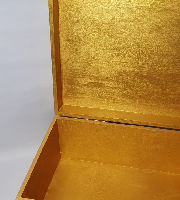 inside gold large wooden box
