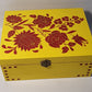 yellow and red painted medium wooden box