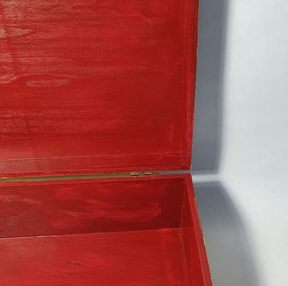 inside red wooden box